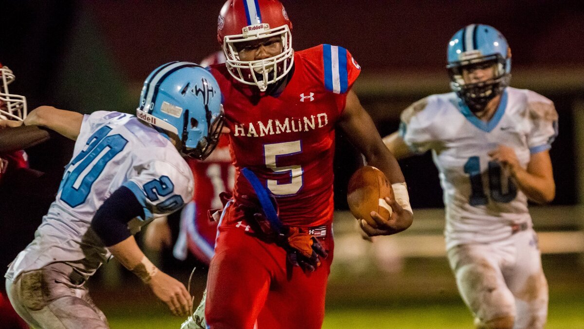 Hammond Skyhawks Jordan Burch (5) rushes for a long touchdown during the quarter-final playoff game between Wilson Hall at Hammond.