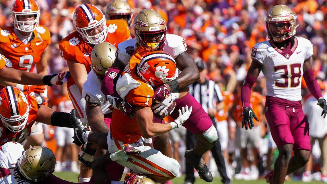 Sep 23, 2023; Clemson, South Carolina, USA; Clemson Tigers running back Will Shipley (1) is tackled by Florida State Seminoles linebacker Tatum Bethune (15) in the second half at Memorial Stadium. Mandatory Credit: David Yeazell-USA TODAY Sports