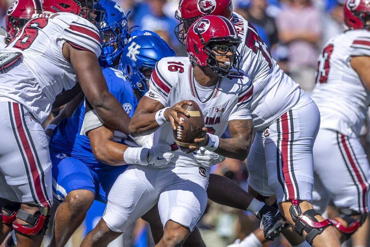 Kentucky Wildcats defensive lineman Tre’vonn Rybka (90) wraps up South Carolina Gamecocks quarterback LaNorris Sellers (16) during at game at Kroger Field in Lexington, Ky., on Saturday, Sept. 7, 2024.