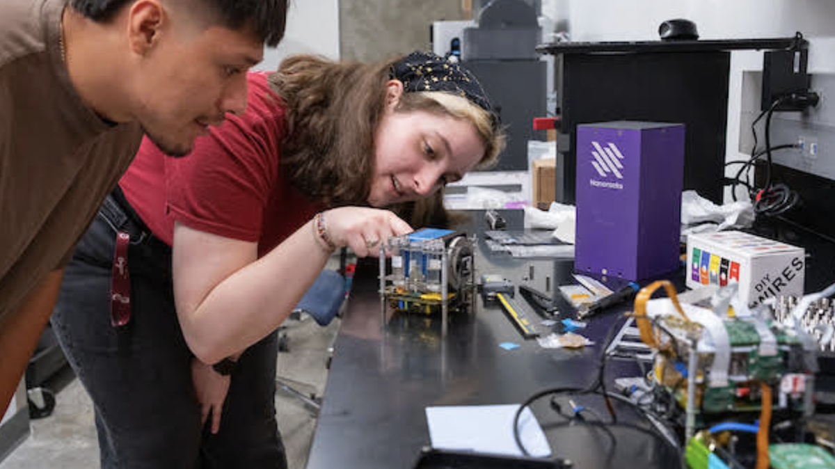 An image of College of Charleston astrophysics students Eva Godwin and Gael Gonzalez