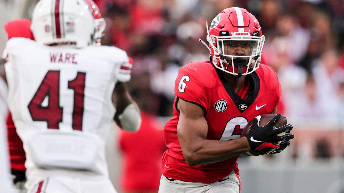 Georgia running back Kenny McIntosh (6) carries the ball against South Carolina during the first half of an NCAA college football game Saturday, Sept. 18, 2021, in Athens, Ga. (AP Photo/Butch Dill)