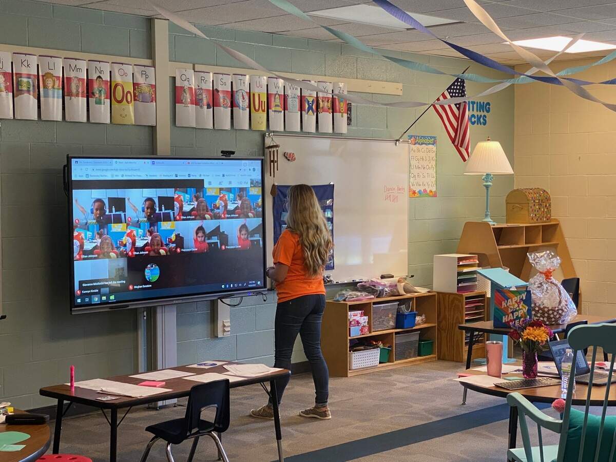 Round Top Elementary School kindergarten teacher Meghan Sonatore instructs her class through video from her classroom.
