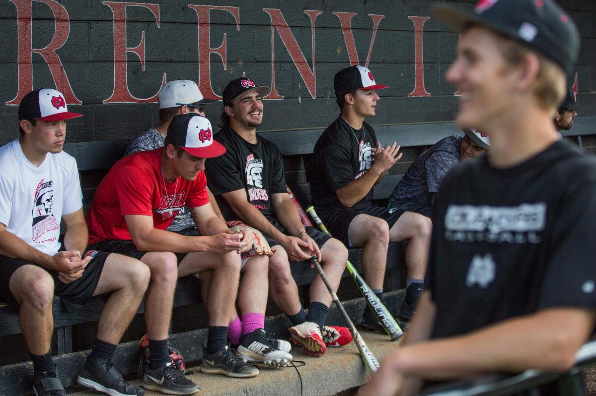 North Greenville University's John Jones, center, laughs with his teammates  during practice Wednesday April 25, 2018, at North Greenville University in Tigerville, SC. Jones played at the University of South Carolina before transferring to North Greenville University.