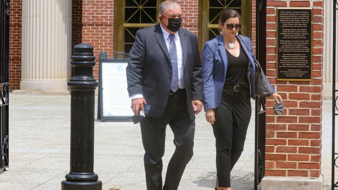 Westinghouse executive Carl Churchman, accompanied by his attorney, leaves the Mathew J. Perry Federal Courthouse in June 2021 after pleading guilty to lying to the FBI.