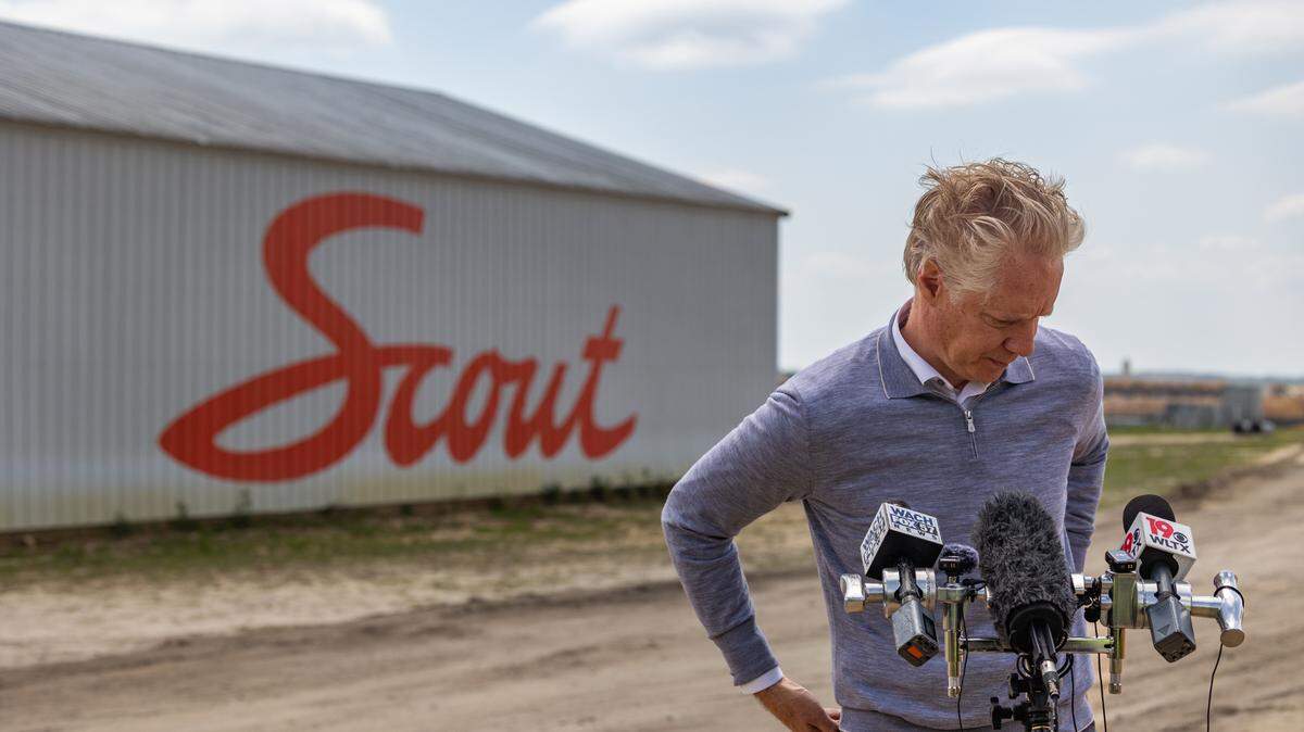 Scout Motors CEO Scott Keogh speaks to reporters at the Scout Motors manufacturing plant in Blythewood, South Carolina on Thursday, April 10, 2025.