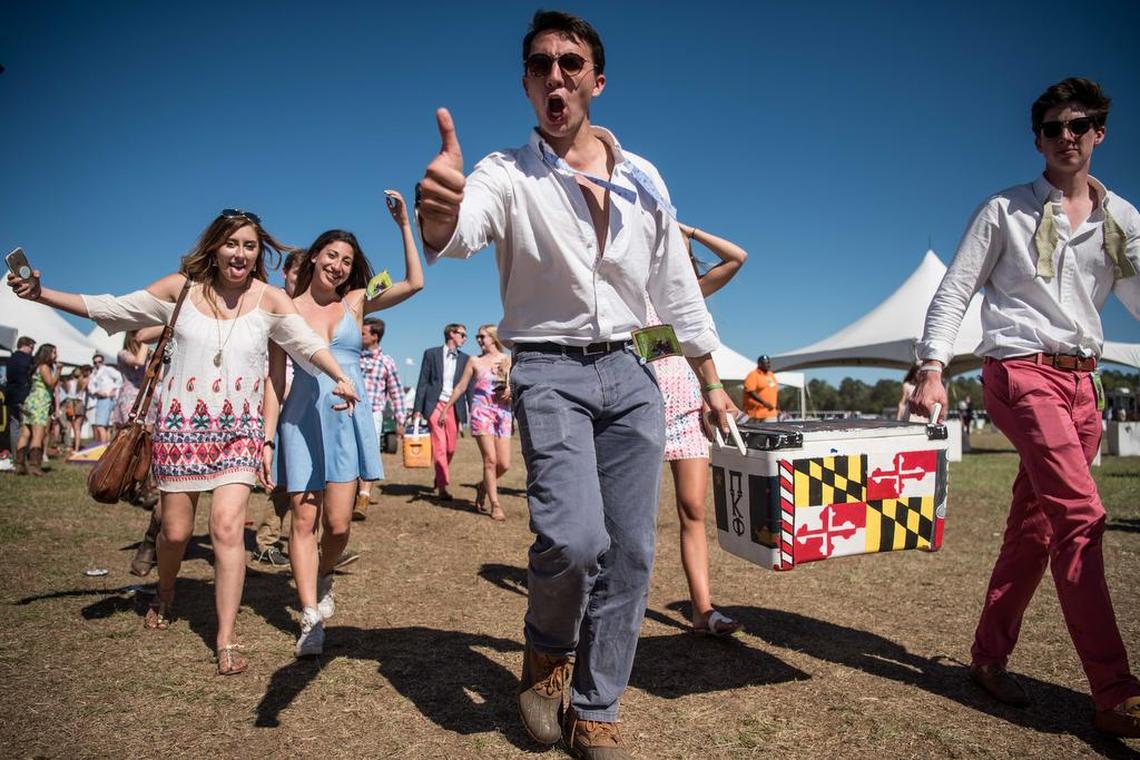Revelers exit the infield at the Springdale Racetrack during the Carolina Cup in Camden. The yearly event attracts thousands of horse fans and party people.