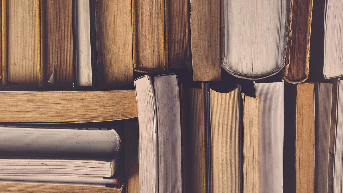 Stack of Used Old Books in the School Library, Toned Cross Processed Image. Getty Images | Royalty Free