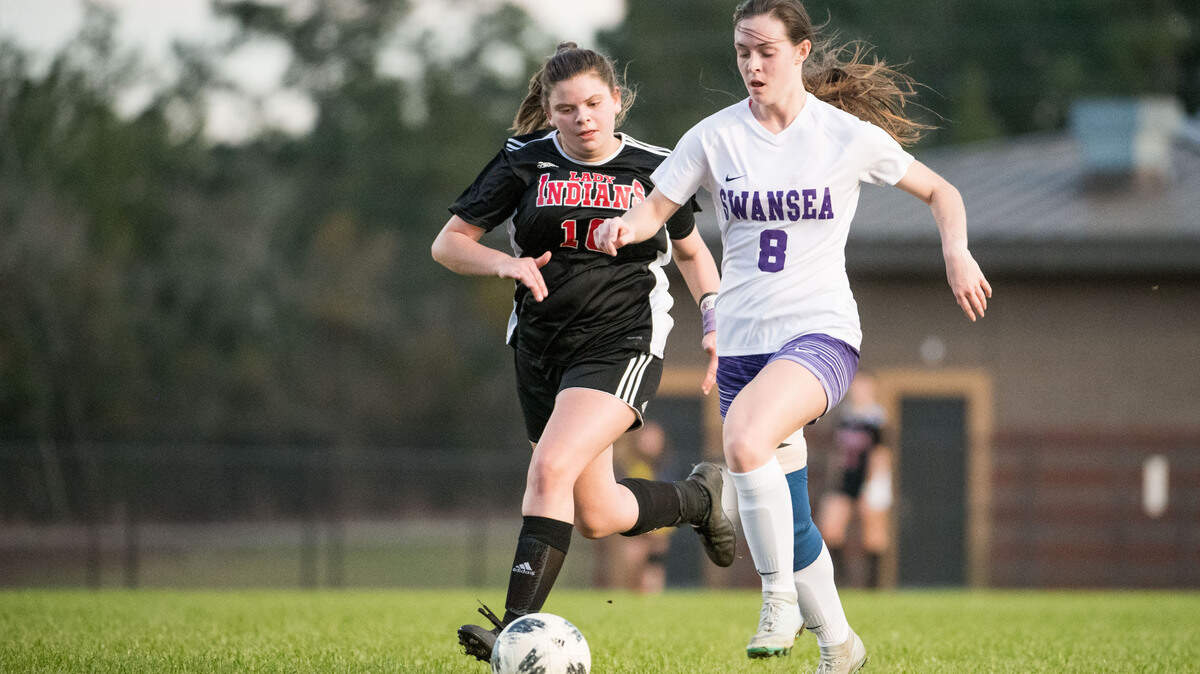 Swansea senior forward Bri Reynolds breaks away from Gilbert defender Erin Bathie to score her second goal of the game Tuesday, Feb. 13, 2019, in Gilbert, S.C. Reynolds is one of the best high school players in the state and scored four goals to help Swansea defeat Gilbert.