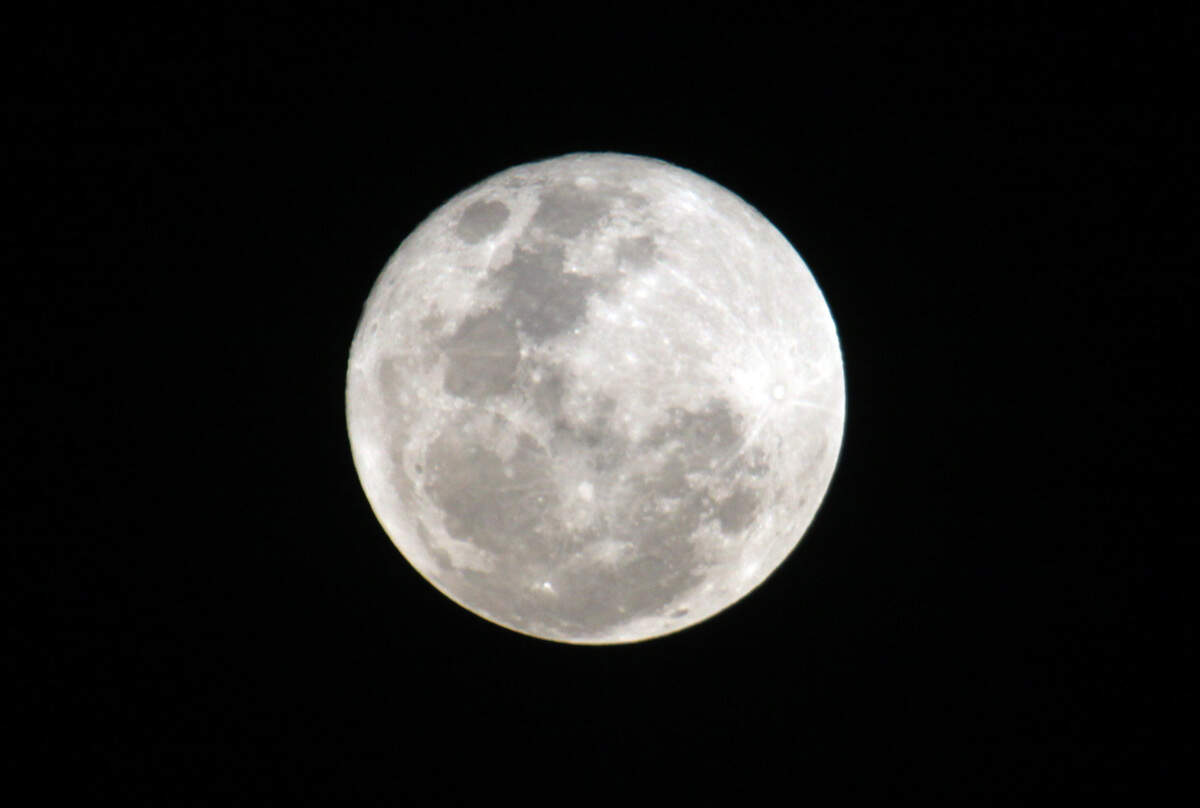 FILE - This Saturday, Jan. 30, 2010 file photo shows the full moon from Nairobi, Kenya; as the second one of the month, it is also called a “blue moon.” A blue moon is expected to appear at 6:43 a.m. EDT Friday, July 31, 2015. (AP Photo/Sayyid Azim)