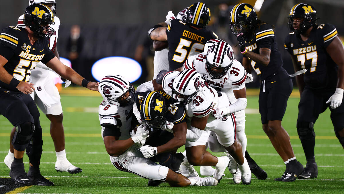 South Caroline defensive players make a tackle during the Gamecocks’ game against Missouri at Memorial Stadium in Columbia, MO on Saturday, September 20, 2025.