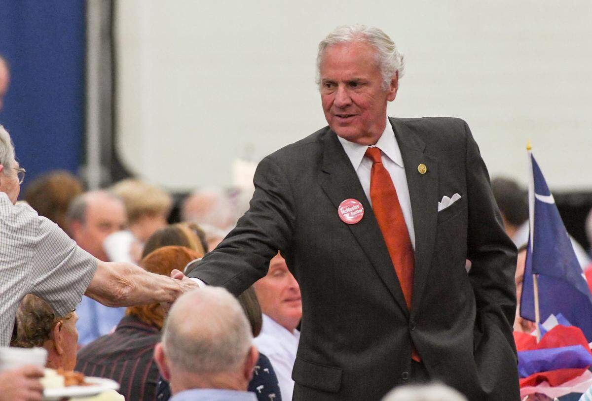 State Gov. Henry McMaster shakes hands with people before speaking at the U.S. Rep. Jeff Duncan Faith and Freedom barbecue fundraiser at the Civic Center of Anderson, S.C. on Monday, August 27.
