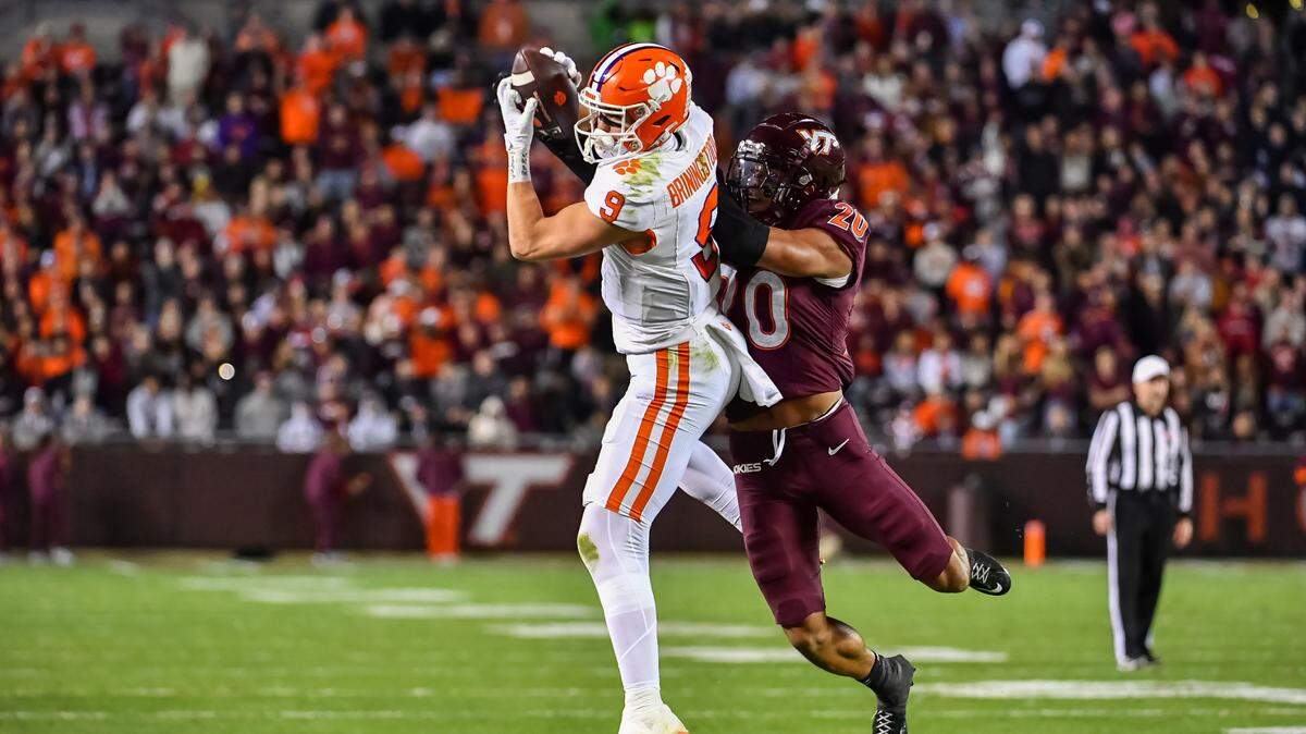 Nov 9, 2024; Blacksburg, Virginia, USA; Clemson Tigers tight end Jake Briningstool (9) catches a pass while being defended by Virginia Tech Hokies linebacker Caleb Woodson (20) during the fourth quarter at Lane Stadium.