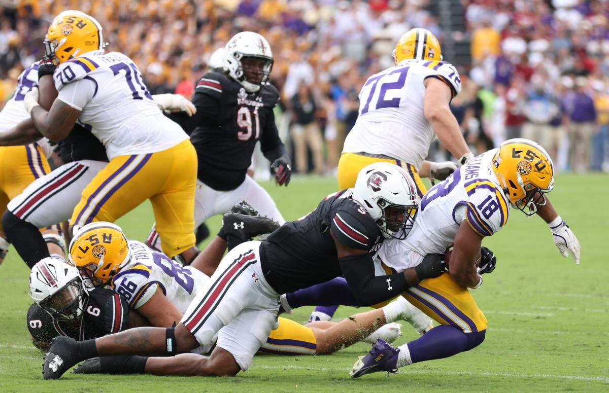 South Carolina edge Kyle Kennard (5) brings down LSU running back Josh Williams (18) during the second half of South Carolina’s game against LSU in Columbia on Saturday, September 14, 2024.