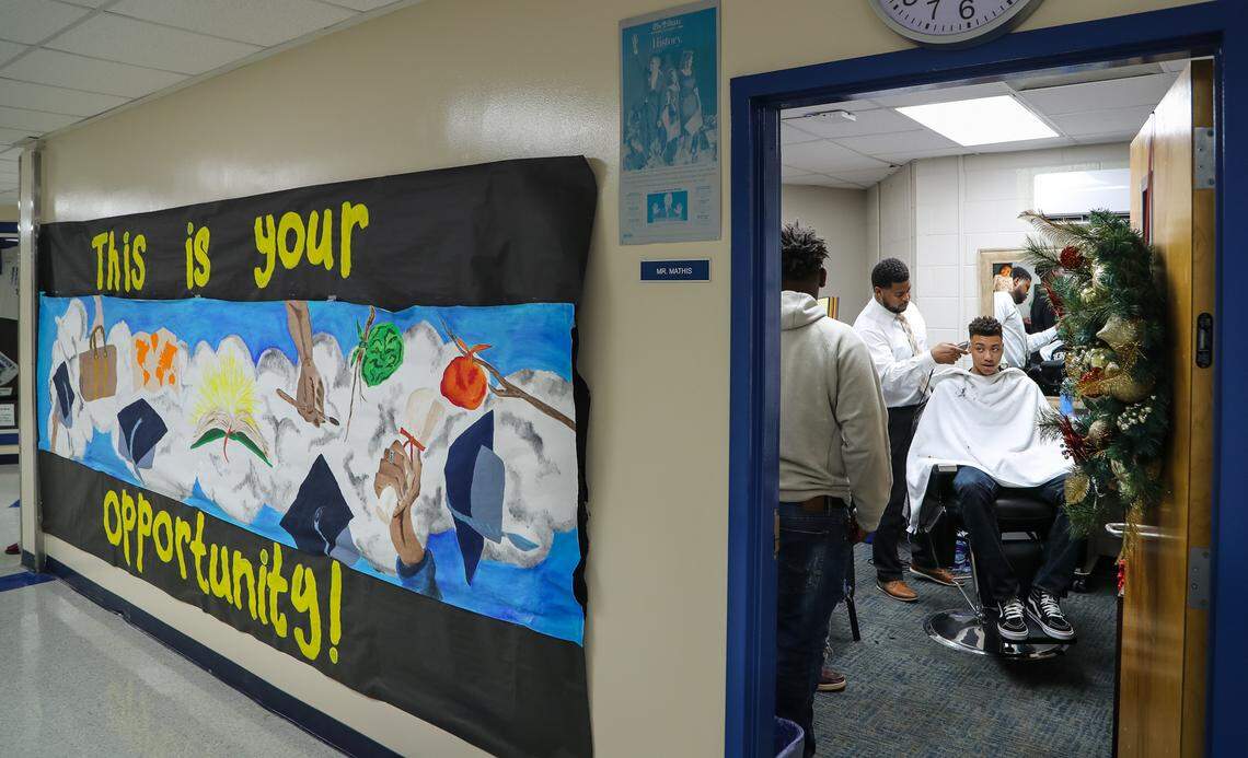 Airport High School assistant principal, Le’Shaun Mathis is using his barbering skills to enhance students esteem, build relationships and reward them for academic achievements. Here Mathis shapes junior Rolando Howell’s hair. 12/12/18