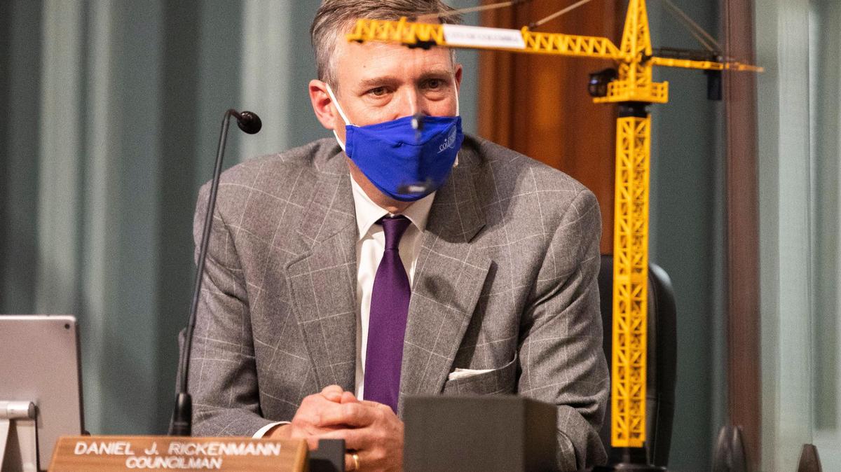 Daniel Rickenmann gazes on a toy construction crane during his last city council meeting as a councilman on Tuesday, December 21, 2021. He is known for saying he wants to see cranes all over Columbia, and city staff gave him the toy as a gift.