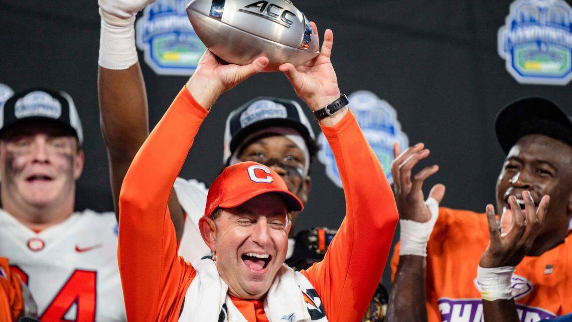 Clemson coach Dabo Swinney holds up the trophy after the team’s win over North Carolina in the Atlantic Coast Conference championship NCAA college football game Saturday, Dec. 3, 2022, in Charlotte, N.C.