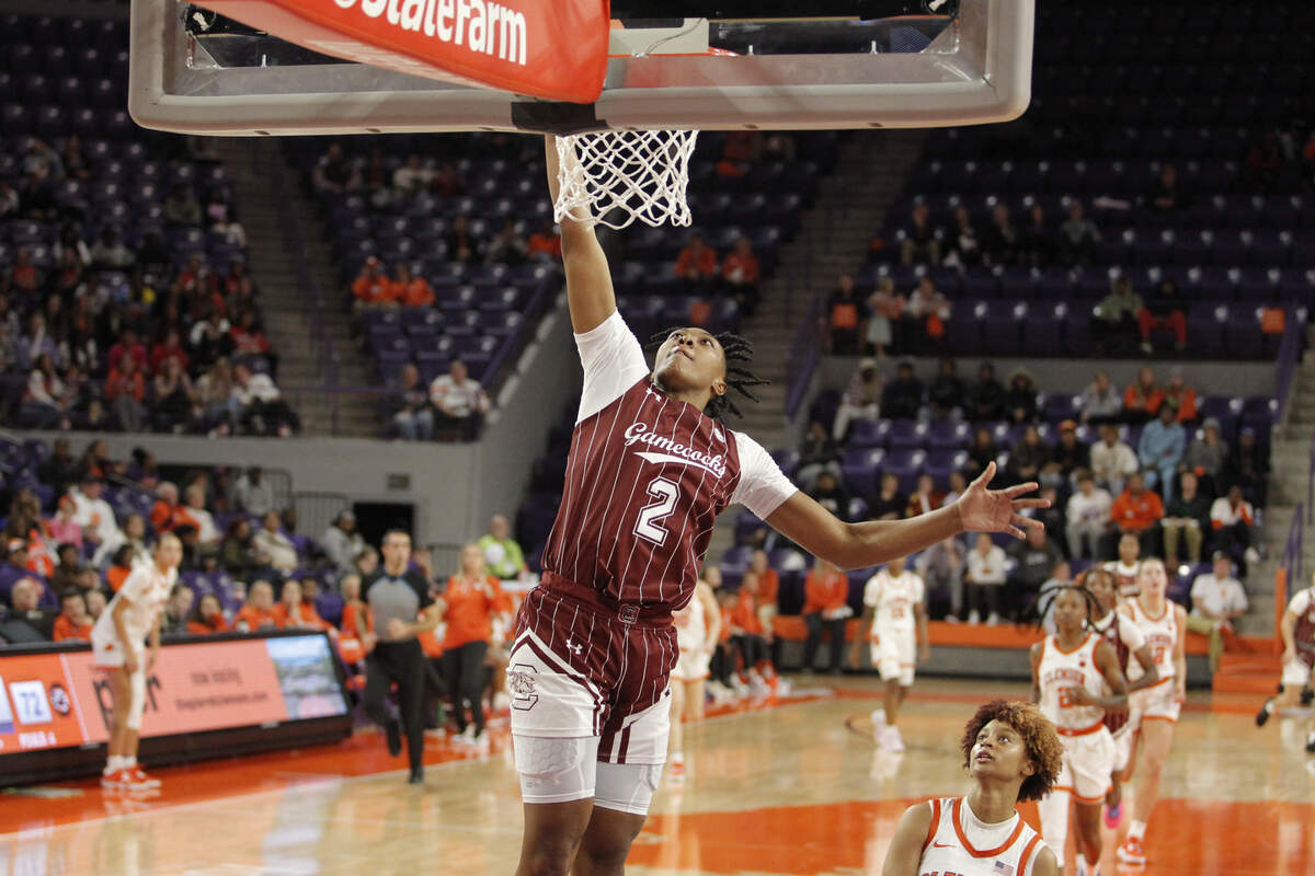 South Carolina forward Ashlyn Watkins (2) throws down a dunk over Clemson guard Ruby Whitehorn during second-half action in Clemson, S.C. on Thursday, Nov. 17, 2022. (Travis Bell/SIDELINE CAROLINA)