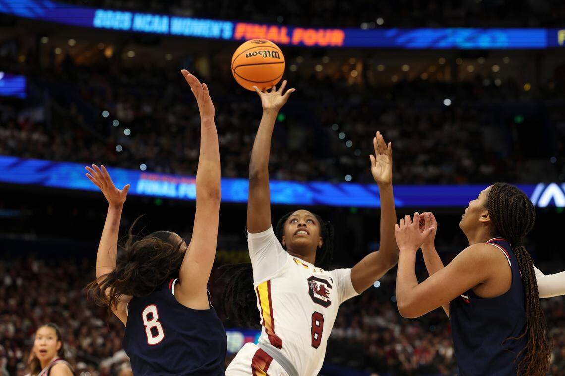 University of South Carolina’s Joyce Edwards (8) shoots as University of Connecticut’s Jana El Alfy (8) and University of Connecticut’s Sarah Strong (21) pressure during the first half of action against the University of Connecticut for the NCAA National Championship at Amalie Arena in Tampa, Fla. on Sunday, April 6, 2025.