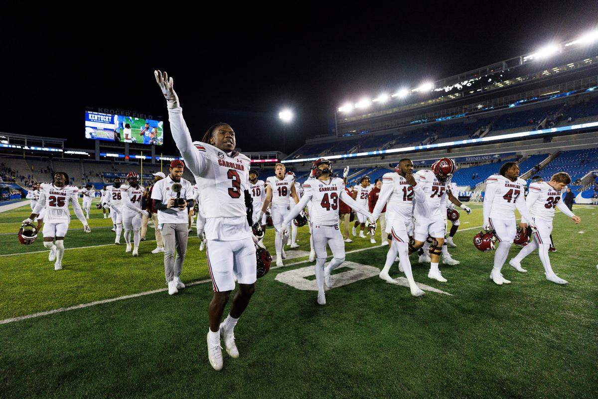South Carolina defensive back Devonni Reed (3) gestures to fans in celebration after the team’s win over Kentucky in an NCAA college football game in Lexington, Ky., Saturday, Oct. 8, 2022. (AP Photo/Michael Clubb)