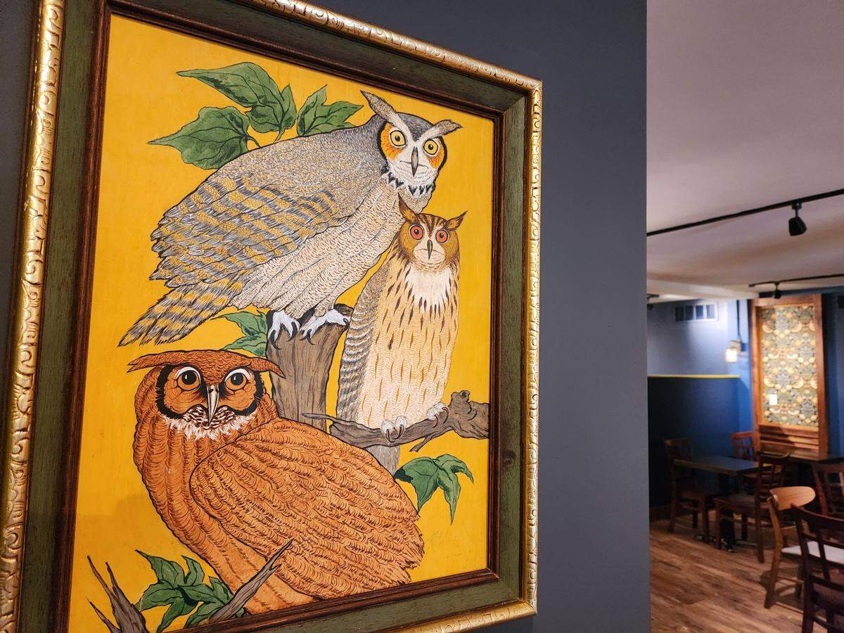 A painting of owls is just one of the bits of decor at The Hoot, a new bar and restaurant coming to Rosewood Drive.