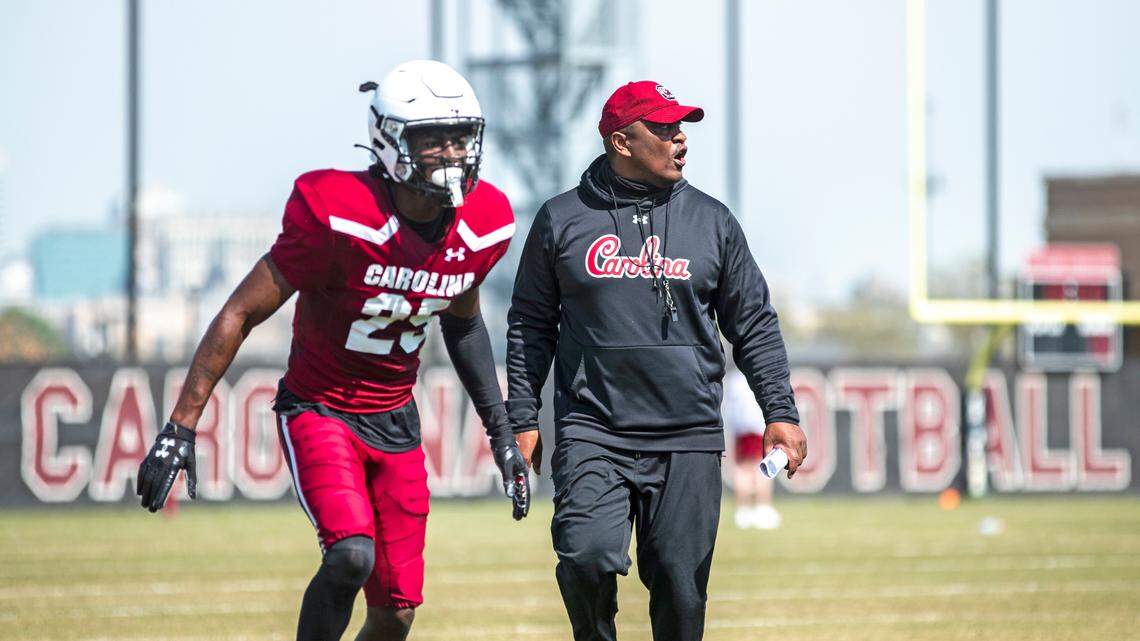 South Carolina defensive back O’Donnell Fortune and defensive coordinator Clayton White during a 2021 spring football practice.