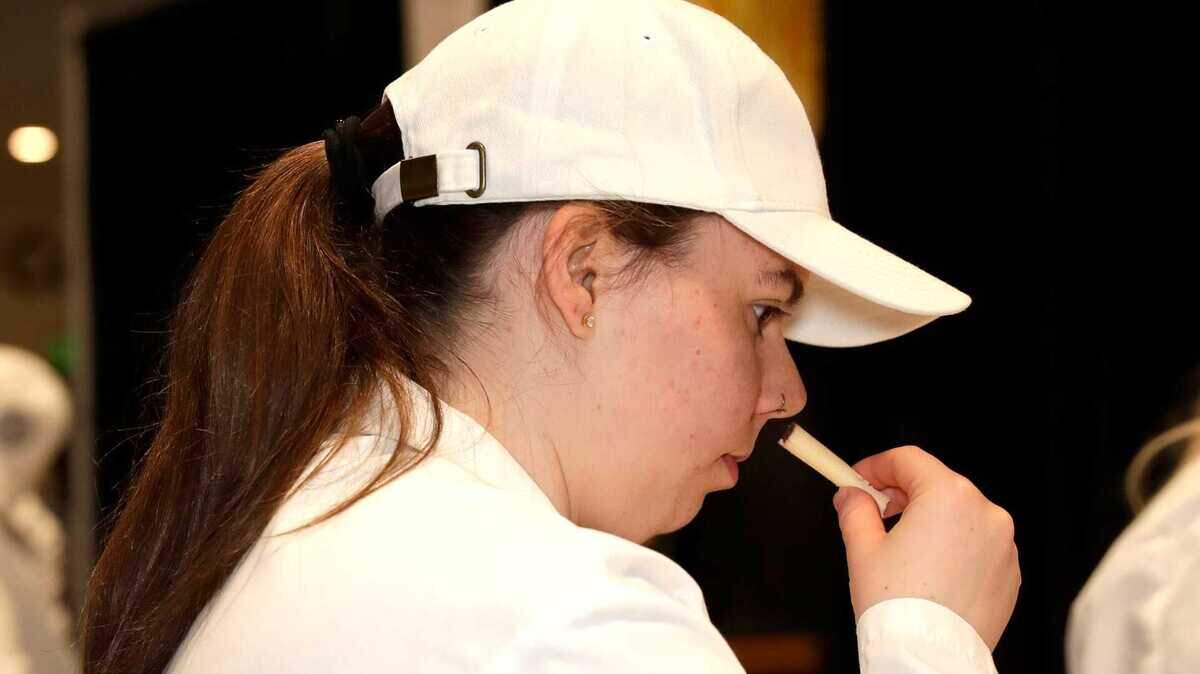 Lucy Jeter, graduate student at Clemson University, evaluates an entry during the first day of judging at the U.S. Championship Cheese Contest on March 4, 2025, at the Resch Expo in Ashwaubenon, Wis.