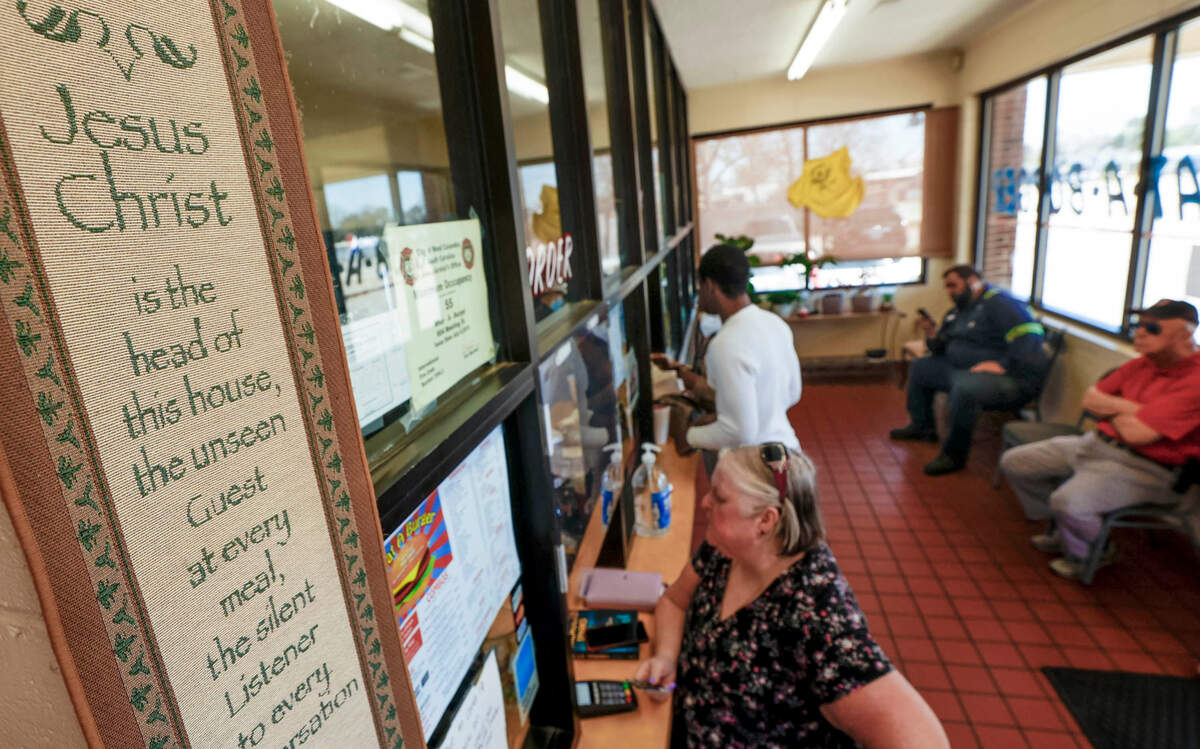 A hanging of the Bible verse, Matthew 18:20 hangs near where patrons place their orders inside the What-a-Burger in West Columbia. The restaurant has been open on Meeting Street since 1953.