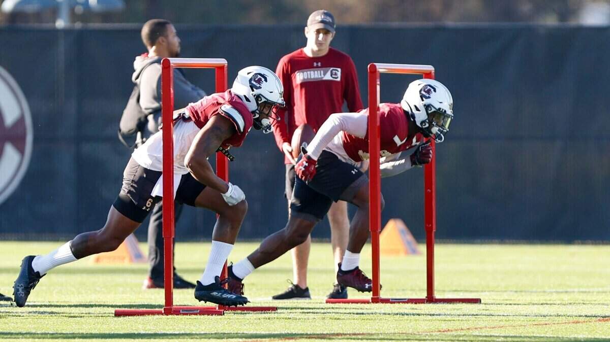 South Carolina receiver Josh Vann (6), left, and receiver Payton Mangrum (85) run drills during an on-campus practice ahead of the Duke’s Mayo Bowl.