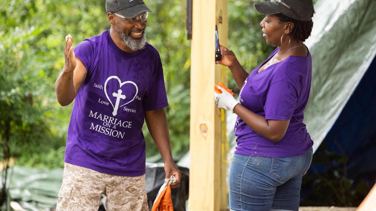 Tony Hayes shows his wife Shawna Hayes a blister he earned while volunteering with Home Works of America on Saturday, May 20, 2023. After retiring and becoming empty nesters, the couple decided to travel the country volunteering, and documenting it on social media.