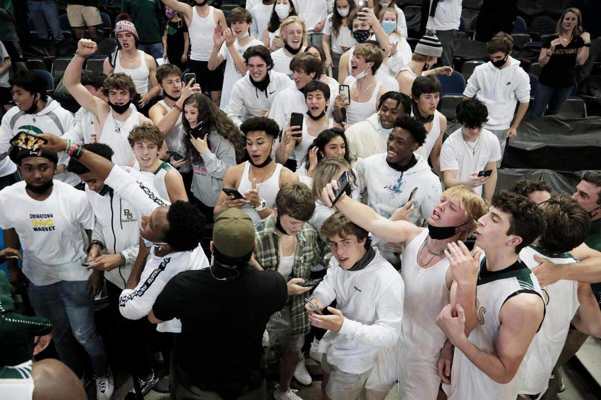 River Bluff fans are held back by law enforcement after River Bluff defeats Dorman in Aiken, South Carolina on Saturday, March 6, 2021.