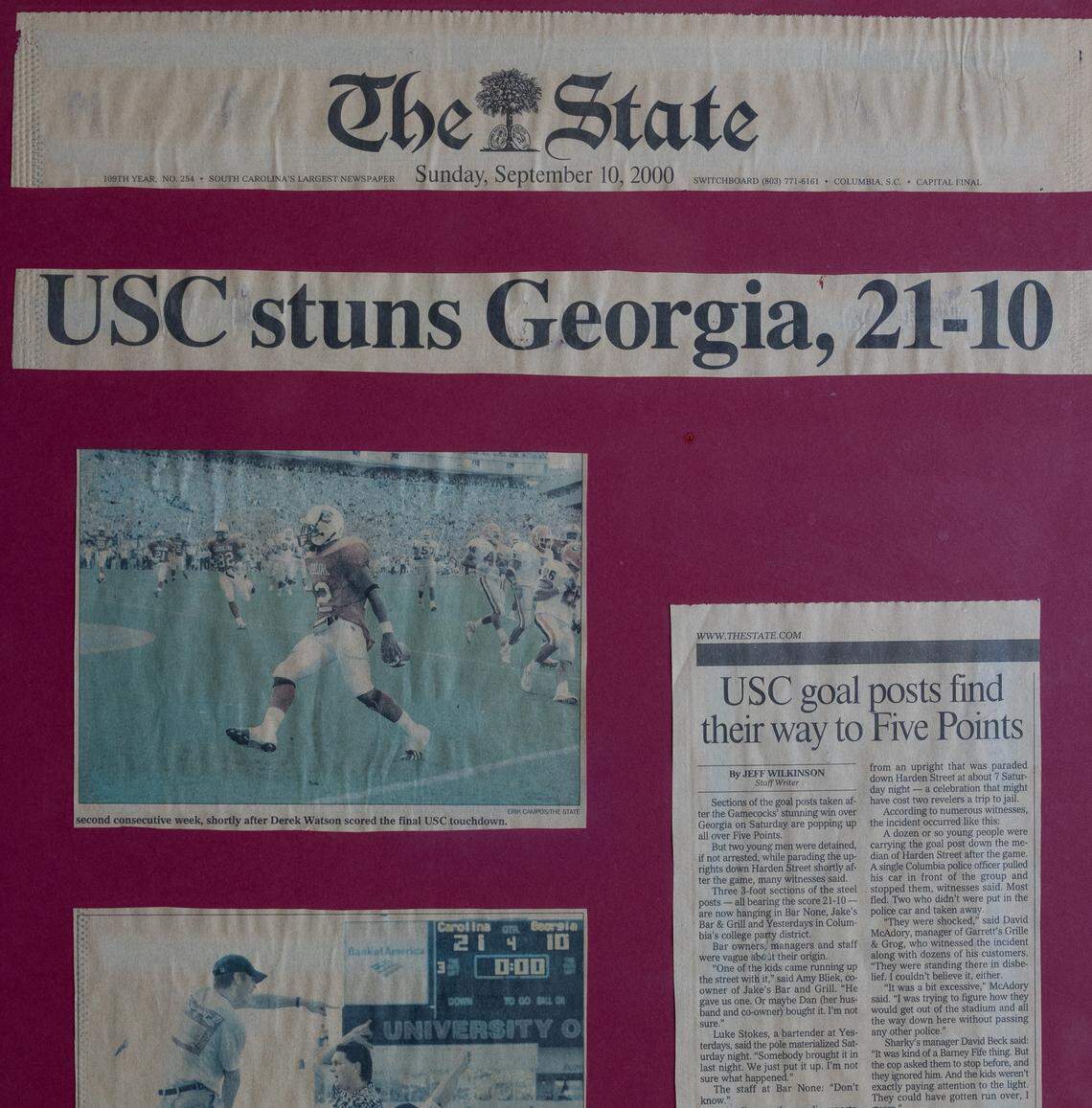 A framed copy of The State newspaper hangs in Columbia’s Bar None in Five Points. A section of the USC goal post is displayed at Bar None in Columbia’s Five Points. It is signed by then USC football coach Lou Holtz, on Wednesday.