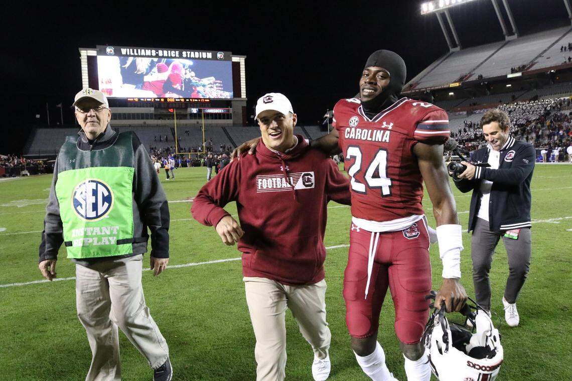 South Carolina’s head coach Shane Beamer and wide receiver Eriq Rice (24) walk off the field after the Gamecocks beat Florida at Williams-Brice Stadium.
