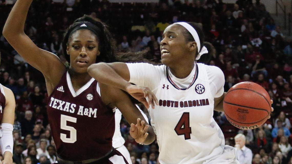 South Carolina's Doniyah Cliney (4) drives around Texas A&M's Anriel Howard (5) during the second half of action in the Colonial Life Arena. 12/31/17