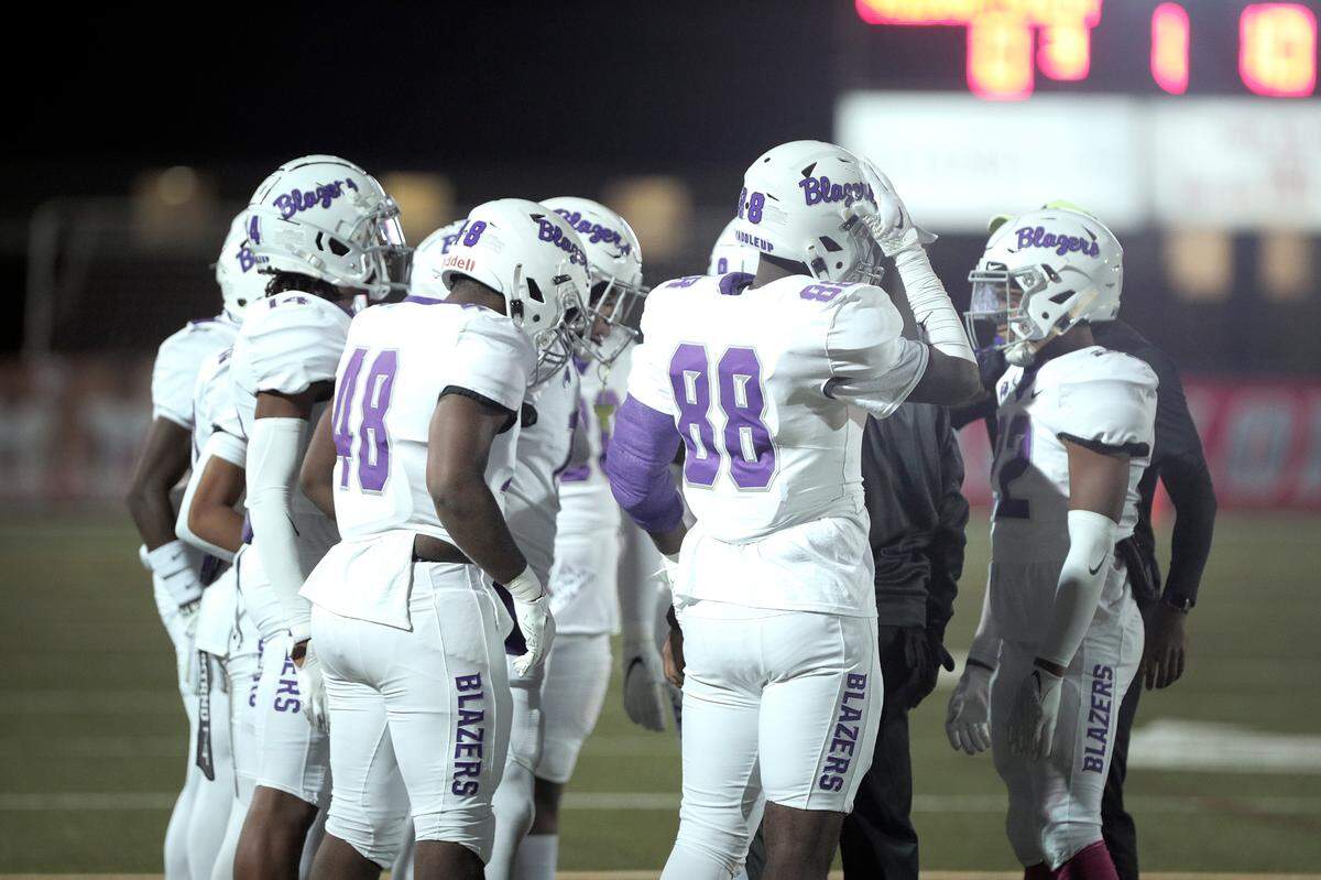 Ridge View huddles during their game against AC Flora at Memorial Stadium in Columbia on Friday, Oct. 28, 2022.