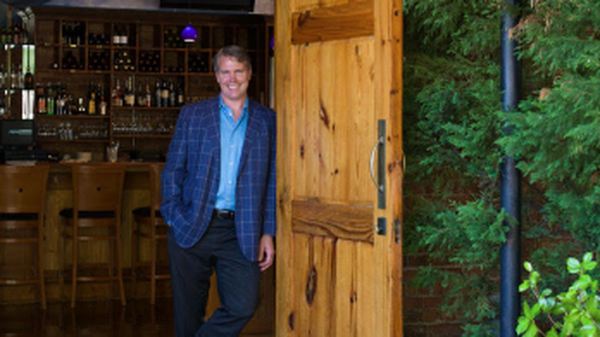 Carl Sobocinski stands in the doorway of his signature Greenville restaurant, Soby’s.