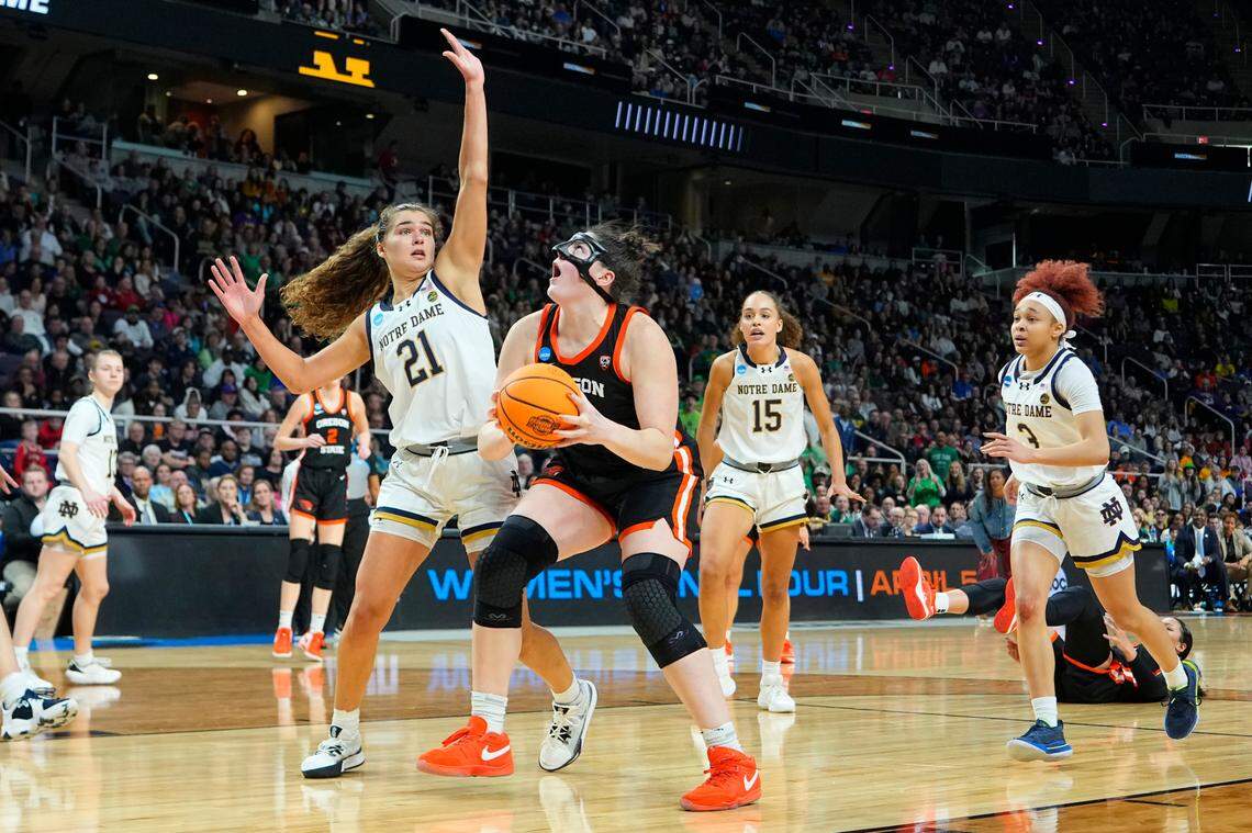 Mar 29, 2024; Albany, NY, USA; Oregon State Beavers forward Raegan Beers (15) looks to put up a shot against Notre Dame Fighting Irish forward Maddy Westbeld (21) during the second half in the semifinals of the Albany Regional of the 2024 NCAA Tournament at the MVP Arena at MVP Arena.