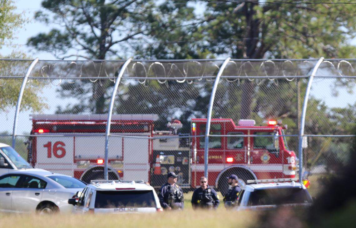 Emergency officials and law enforcement agencies stage outside the Department of Juvenile Justice in Columbia on Tuesday Oct. 18, 2022.