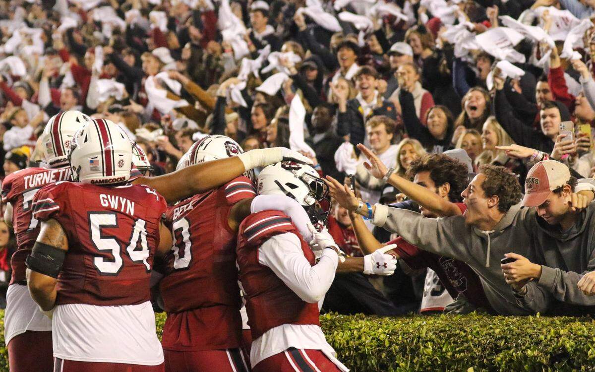 Fans and teammates embrace South Carolina’s Josh Vann (6) after he scored a touchdown as the Gamecocks take on Florida on Saturday, Nov, 6, 2021 at Williams-Brice Stadium.