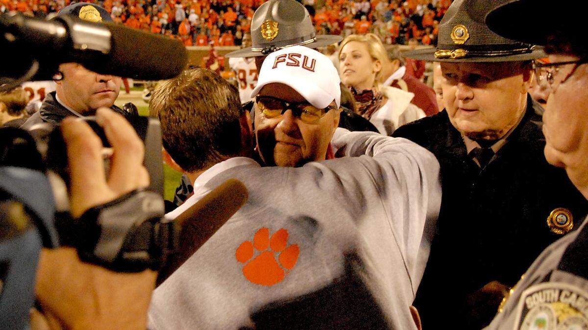 Clemson and Florida State head coaches, Bobby Bowden, facing, and Dabo Swinney embrace after the Tigers defeated the Seminoles 40-24 during their NCAA college football game Saturday Nov.7, 2009 at Memorial Stadium in Clemson S.C. (AP Photo/ Richard Shiro)