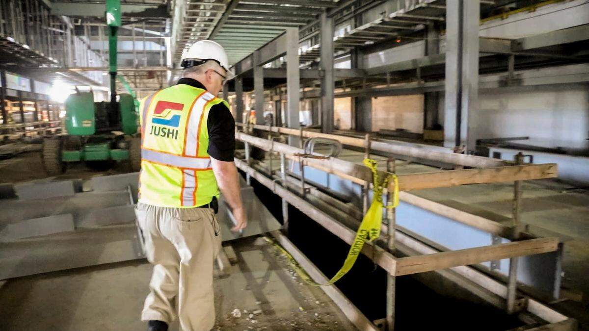 Workers during construction at the China Jushi fiberglass plant in Columbia. The Chinese company makes spun fiberglass and was a prized industrial recruit when it opened the $300 million plant in 2019. Sept. 20, 2018