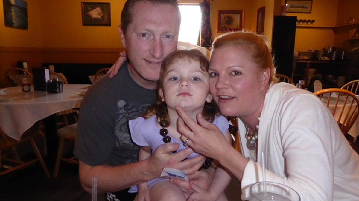Dr. Adam Lazzarini with his wife, Vanessa, Biery and their daughter Brooke.