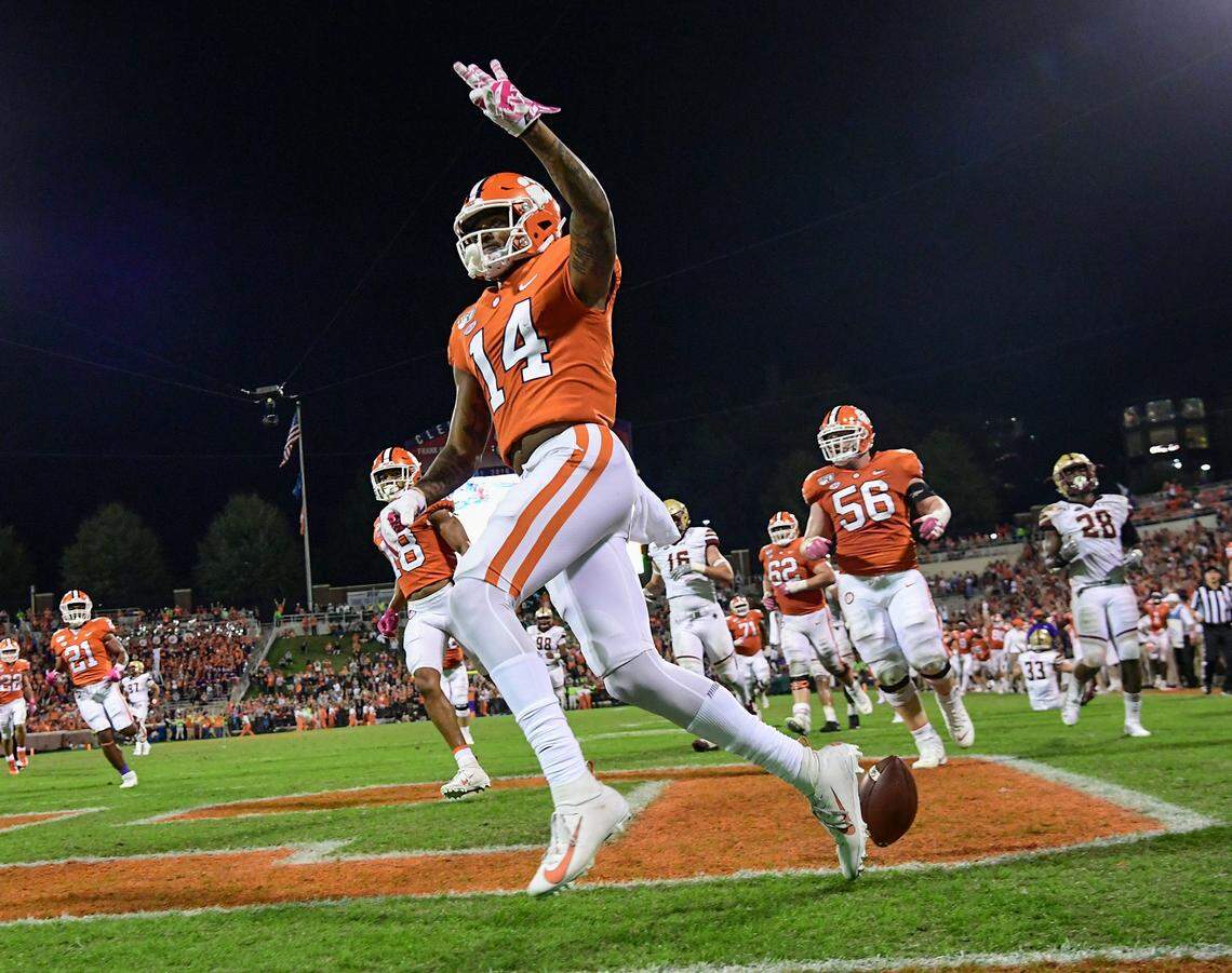 Clemson wide receiver Diondre Overton (14) holds up three fingers scoring his third touchdown of the game during the fourth quarter at Memorial Stadium with Boston College in Clemson, South Carolina Saturday, October 26, 2019.