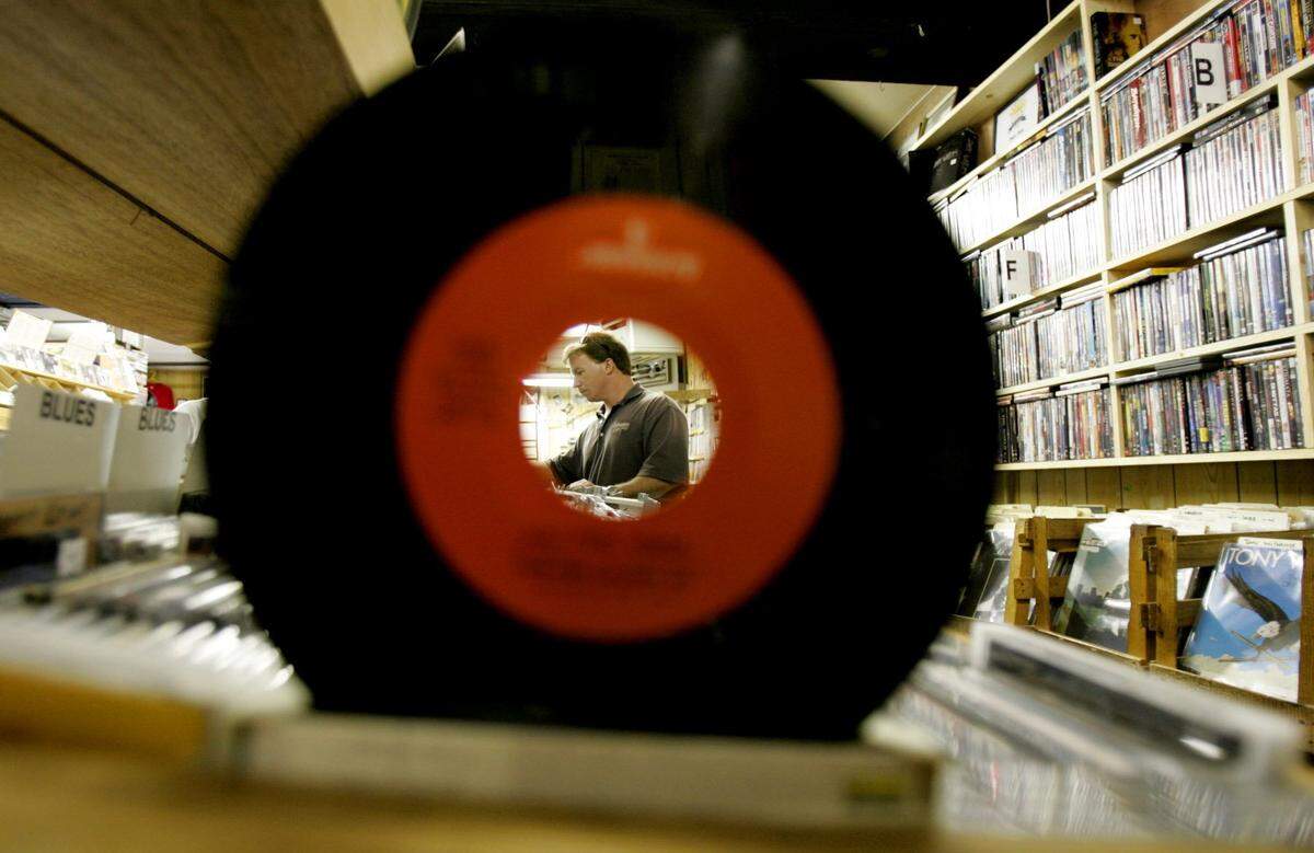 COLUMBIA, SC TUESDAY, NOVEMBER 20, 2007 ERIK CAMPOS---With streetscaping complete and real estate turning over, the character of Columbia’s 5 Points could lose its character as plans for condominiums and high end boutiques try to replace independent shops. Here, Chuck Pace CQ of Columbia sifts through the CD’s in the country music section of Papa Jazz on 11/20/2007. Erik Campos/ecampos@thestate.com