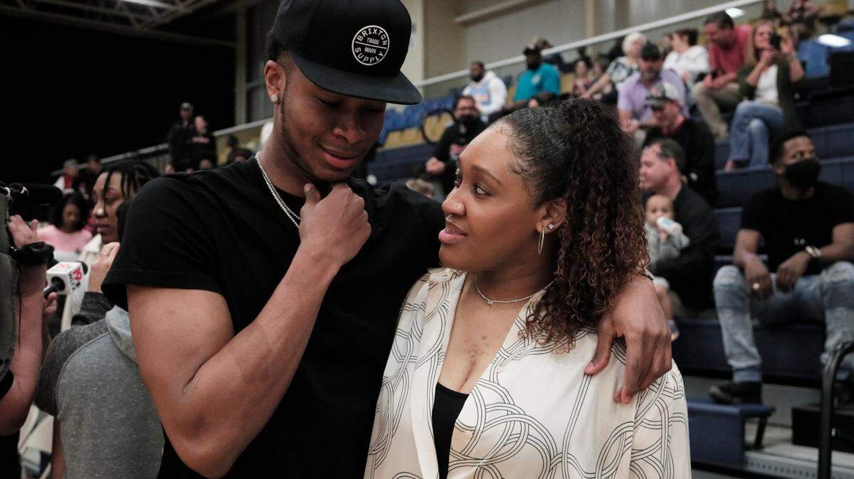 Cardinal Newman girls basketball coach Asia Dozier speaks with her brother PJ Dozier after the Cardinals defeated First Baptist to win the 2022 SCISA Class 3A tournament at the Sumter Civic Center on Saturday, Feb. 26, 2022.