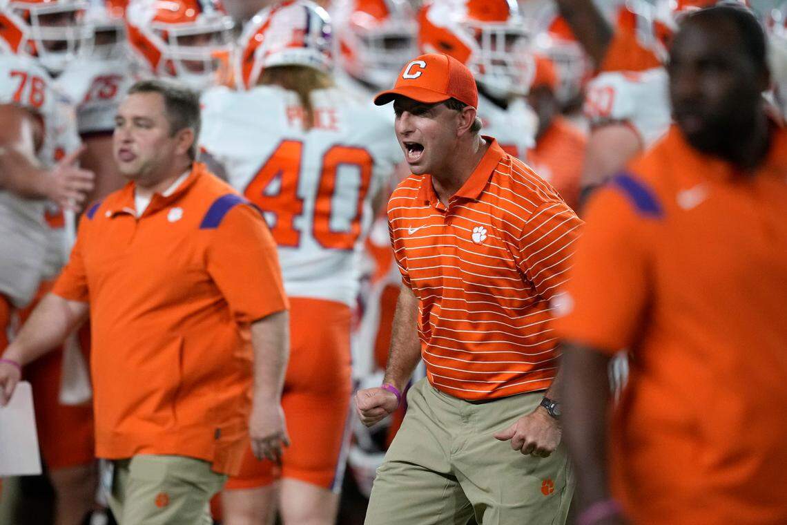 Clemson coach Dabo Swinney encourages players before the team’s Orange Bowl NCAA college football game against Tennessee, Friday, Dec. 30, 2022, in Miami Gardens, Fla. (AP Photo/Rebecca Blackwell)
