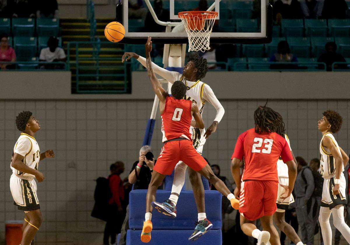 Brandon Crawford (31) of Irmo blocks the shot of Kameron Foman (0) of Hartsville during Irmo’s game against Hartsville at the Florence Center in Florence on Friday, February 24, 2023.