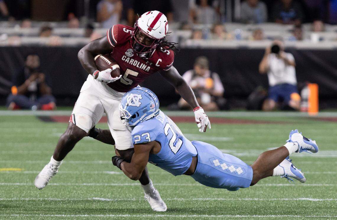 South Carolina running back Dakereon Joyner (5) gets taken down by North Carolina linebacker Power Echols (23) during the Gamecocks’ season opener against North Carolina at Bank of America Stadium in Charlotte on Saturday, September 2, 2023.