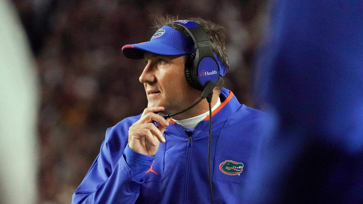 Florida head coach Dan Mullen watches from the sideline during the first half of the team’s NCAA college football game against South Carolina on Saturday, Nov. 6, 2021, in Columbia, S.C. (AP Photo/Sean Rayford)