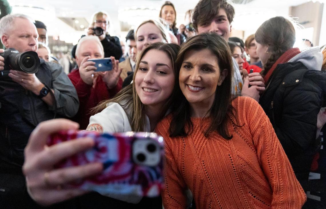 Former United Nations Ambassador Nikki Haley takes a selfie with guests hosting a rally at The Artisan hotel on Monday, Jan. 22, 2024, in Salem, New Hampshire.