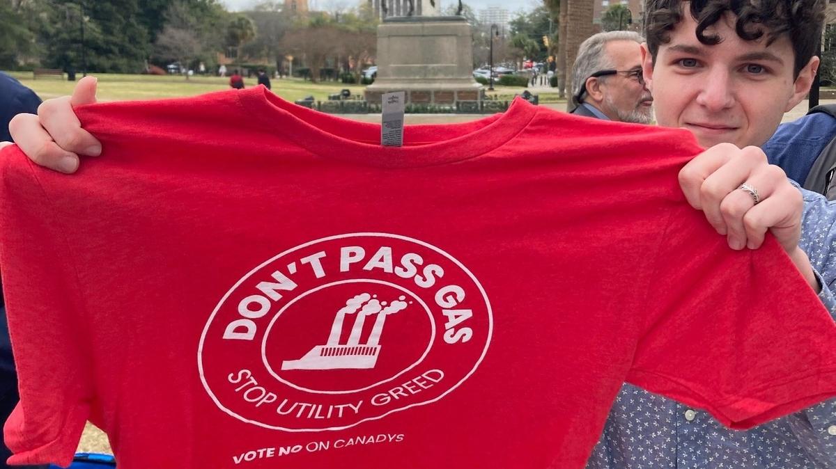 Environmentalists handed out t-shirts Tuesday Feb. 27, 2024) to protest plans for a large new natural gas plant in South Carolina. Opponents say the plant could soak ratepayers with costs and hurt the environment. Utilities say the plant will provide reliable power for future growth.